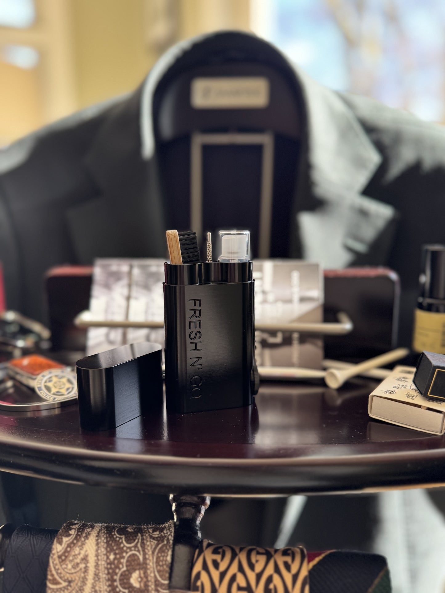 Men’s oral care kit with toothbrush and toothpaste on suit valet