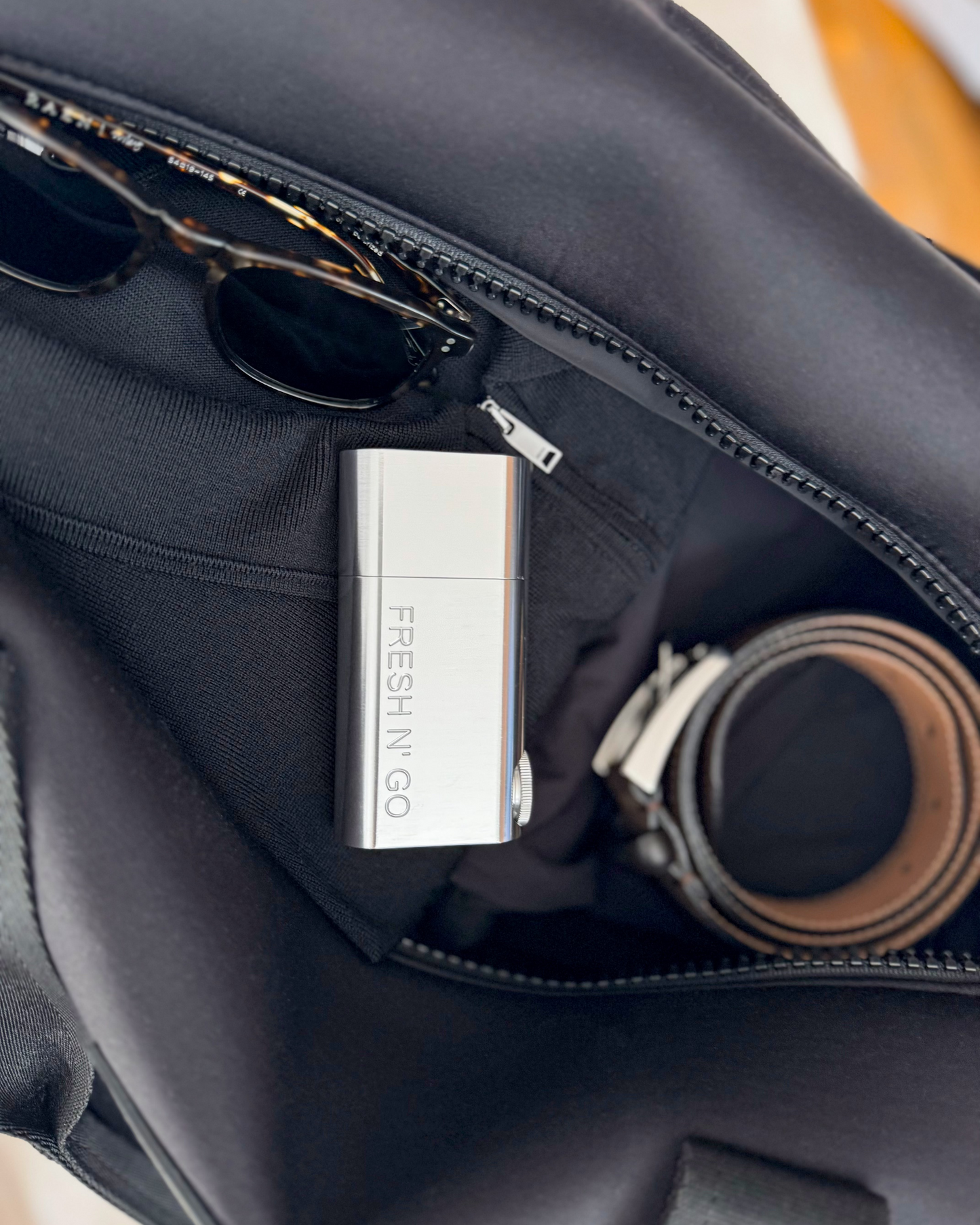 Polished Silver toothbrush kit packed in duffel with men’s accessories