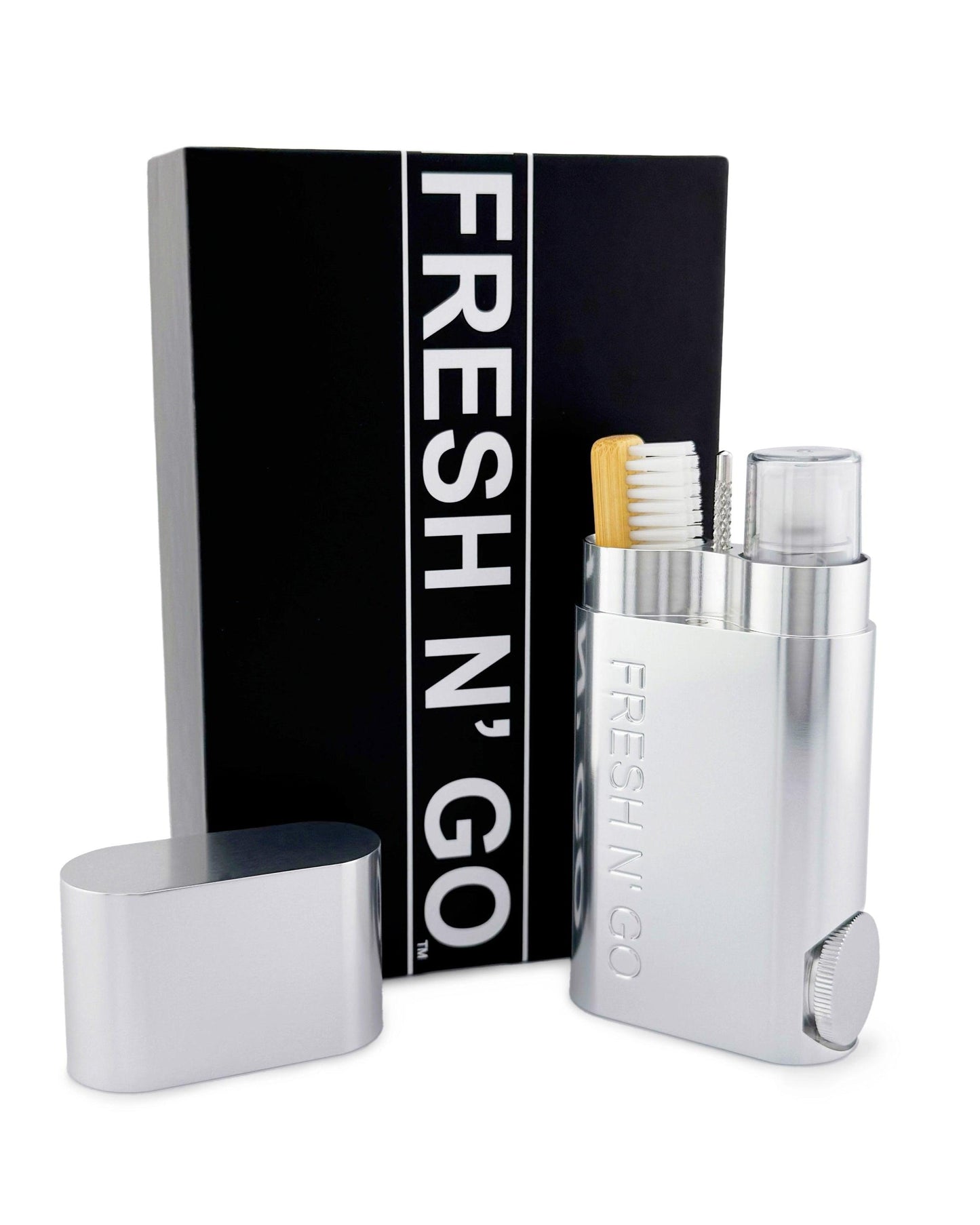 Polished Silver oral care kit open with toothbrush and packaging