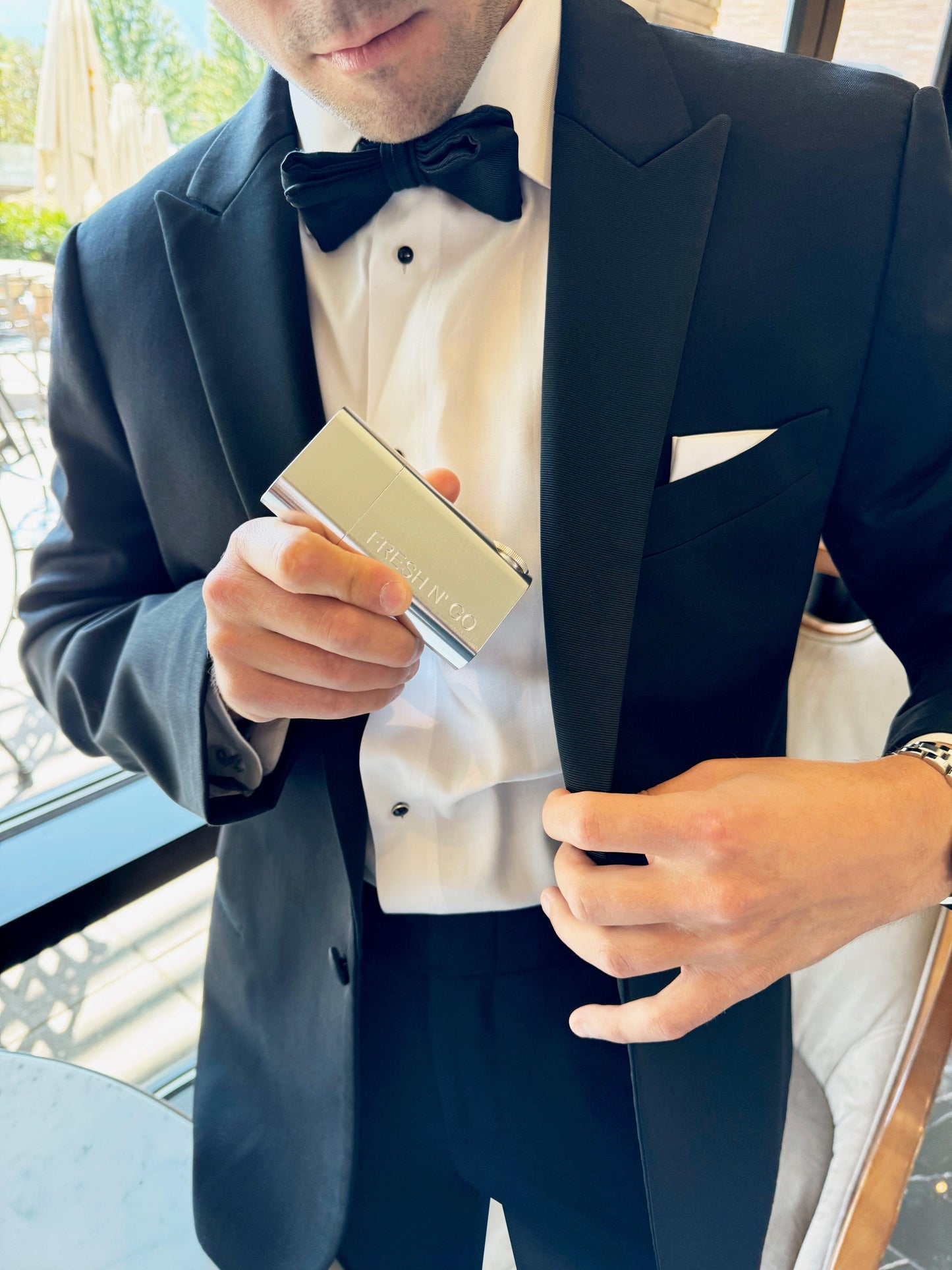 Elegant silver toothbrush kit for men, pocket-sized for formal wear
