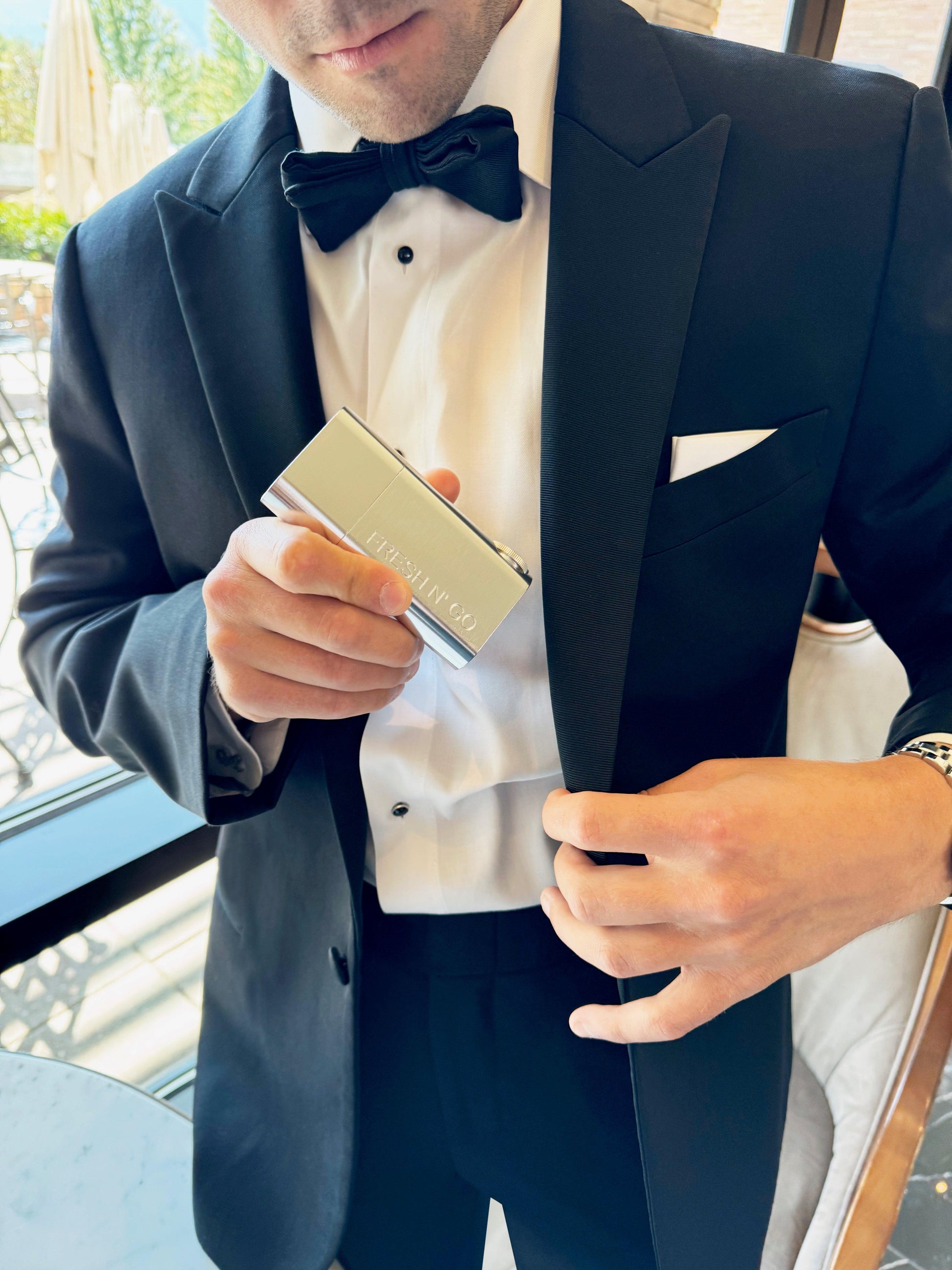 Elegant silver toothbrush kit for men, pocket-sized for formal wear